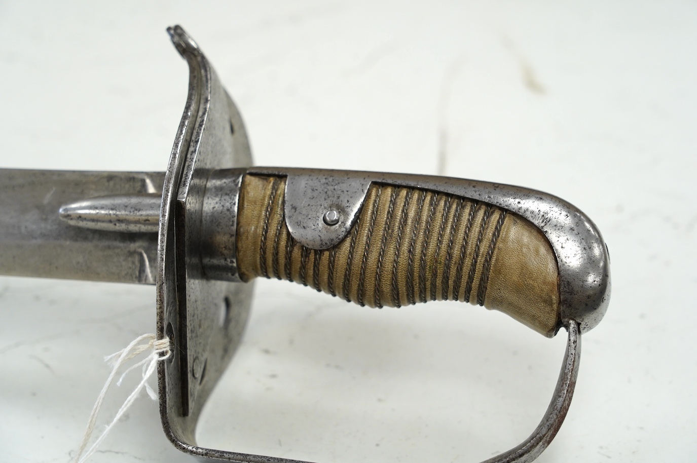 A 1796 heavy cavalry trooper’s sword, regulation blade stamped Dawes, with inspector’s mark, spear point, regulation hilt with side guard removed, grip replaced, blade 88cm. Condition - fair, age wear overall